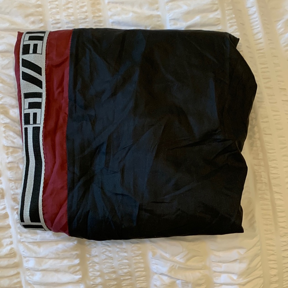 Brand: LF.      Size:xs.    Color: black with dark red on the side.